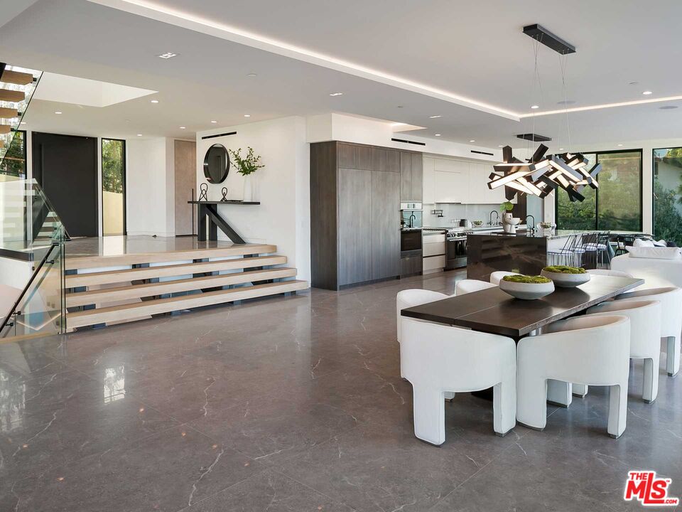 1324 Stradella Road Los Angeles, CA 90077 - Photo 3 of 26 a room with gym equipment and a large window