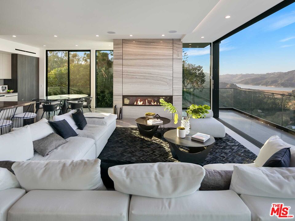 1324 Stradella Road Los Angeles, CA 90077 - Photo 4 of 26 a living room with furniture and a large window
