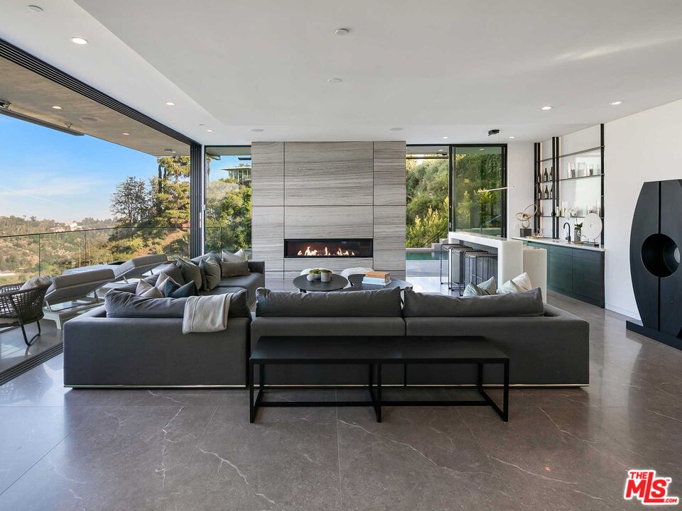 1324 Stradella Road Los Angeles, CA 90077 - Photo 7 of 26 a living room with furniture and a large window