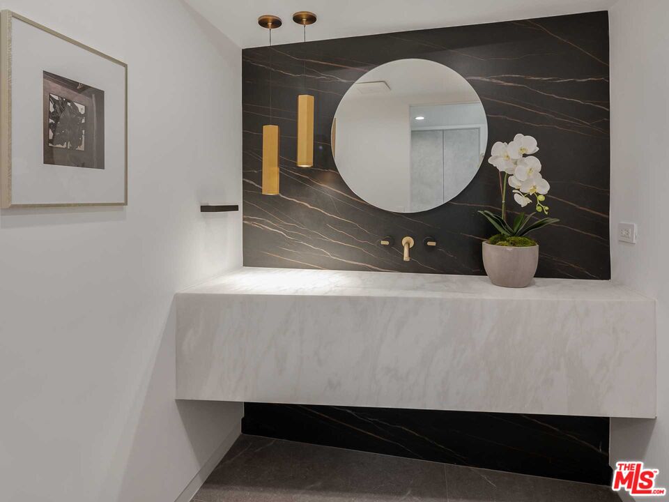 1324 Stradella Road Los Angeles, CA 90077 - Photo 9 of 26 a living room with a table