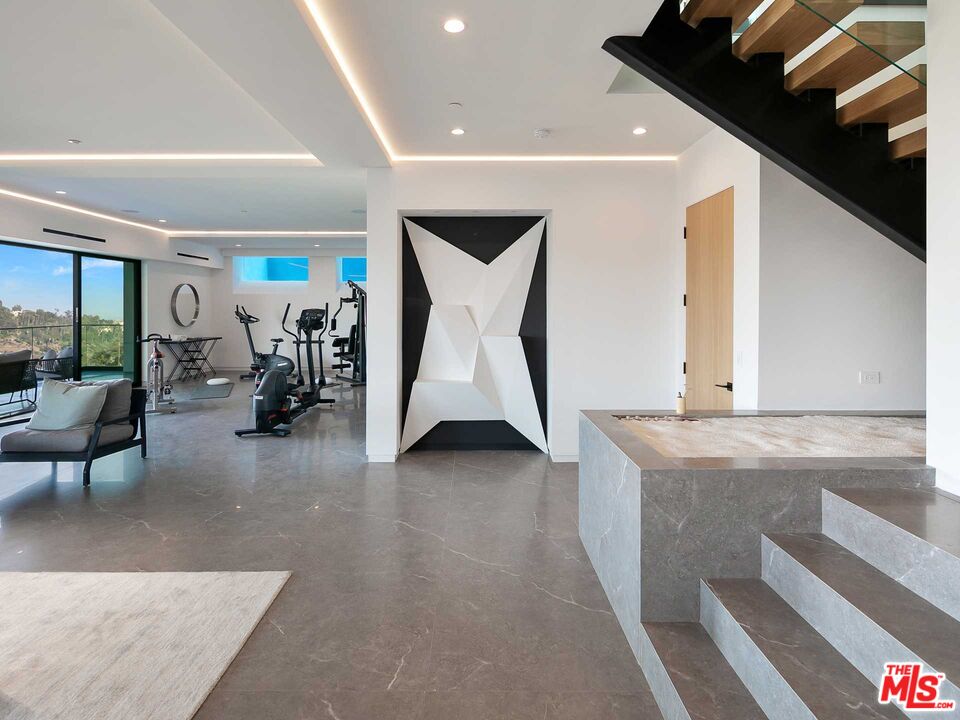 1324 Stradella Road Los Angeles, CA 90077 - Photo 10 of 26 a living room with furniture and white walls