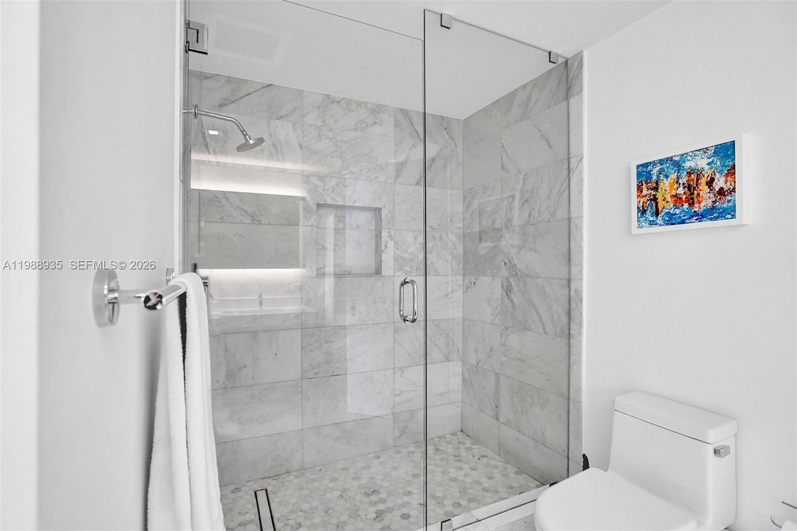 401 North Birch Road, Unit 513 Fort Lauderdale, FL 33304 - Photo 11 of 37 a bathroom with a shower and toilet
