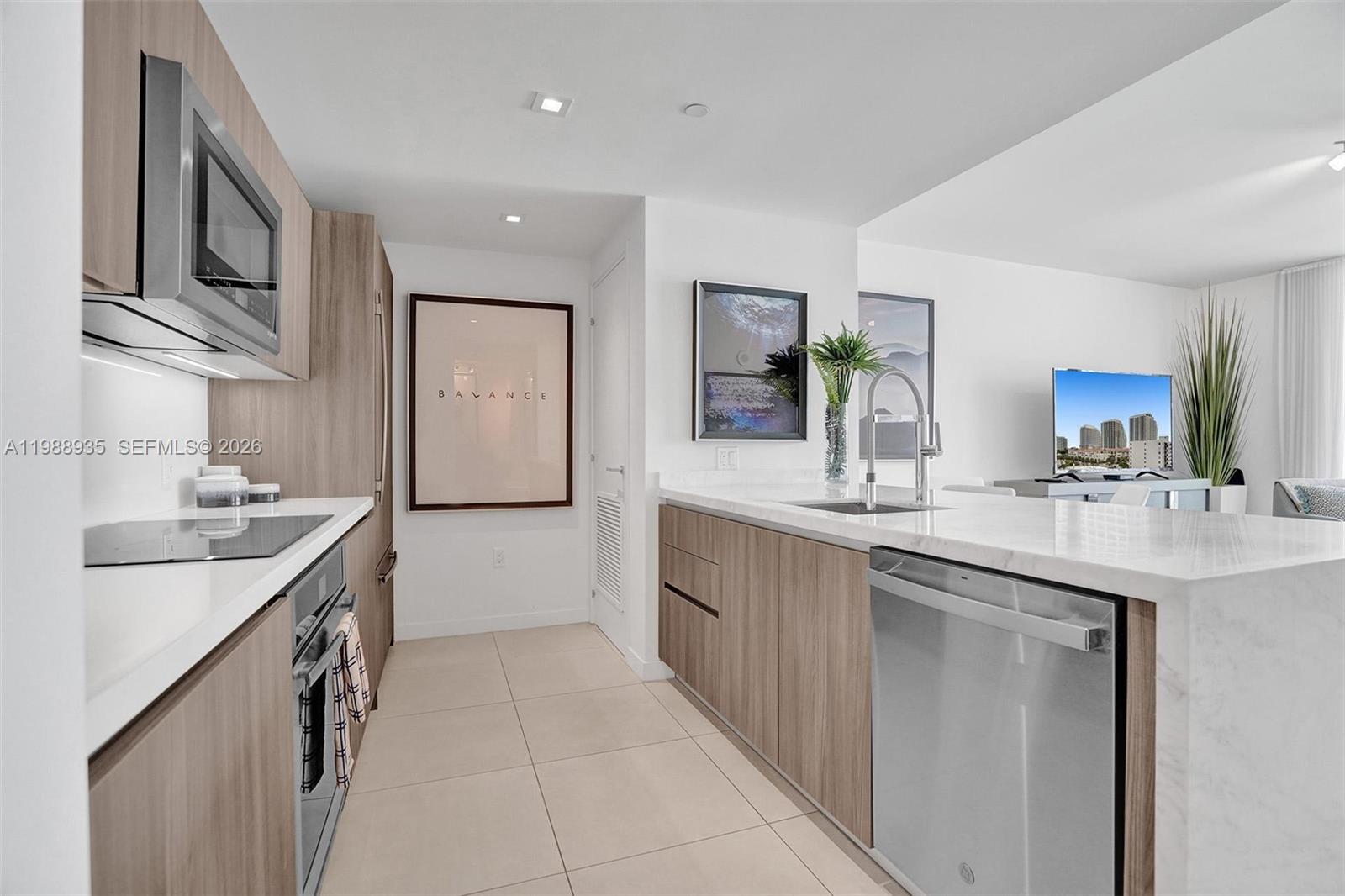 401 North Birch Road, Unit 513 Fort Lauderdale, FL 33304 - Photo 19 of 37 a spacious bathroom with a granite countertop sink a toilet a mirror and shower