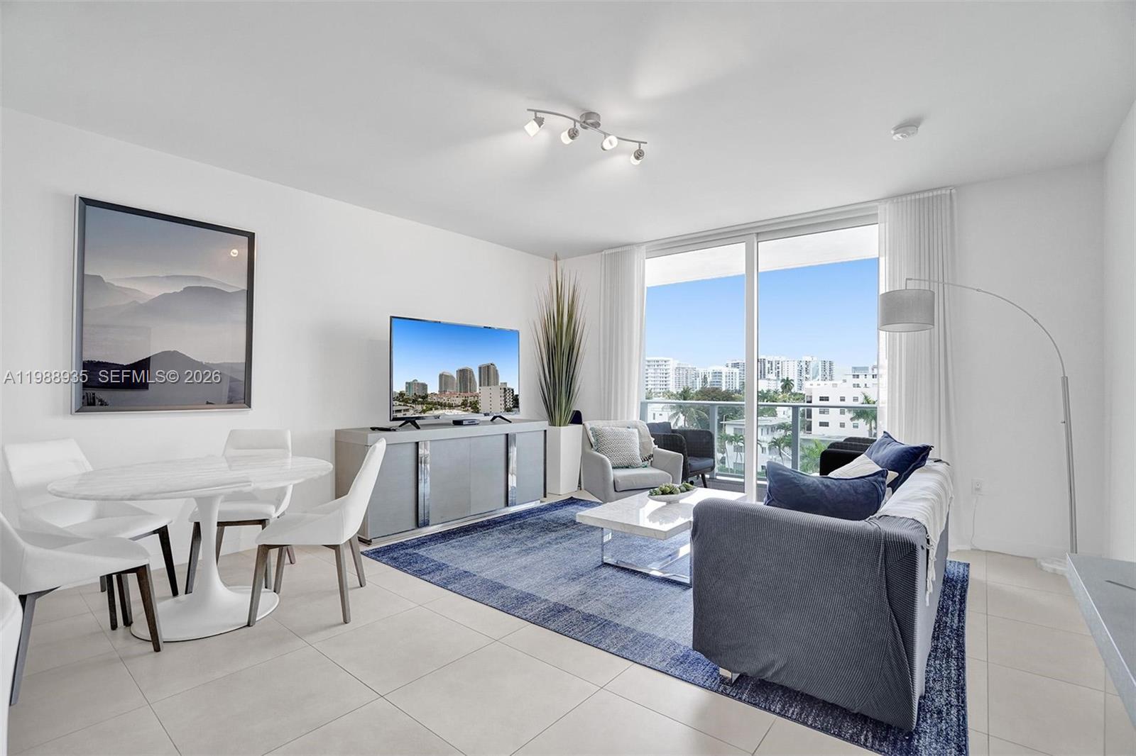 401 North Birch Road, Unit 513 Fort Lauderdale, FL 33304 - Photo 23 of 37 a living room with furniture and a large window