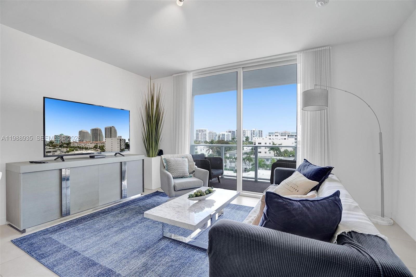 401 North Birch Road, Unit 513 Fort Lauderdale, FL 33304 - Photo 24 of 37 a living room with furniture rug and window