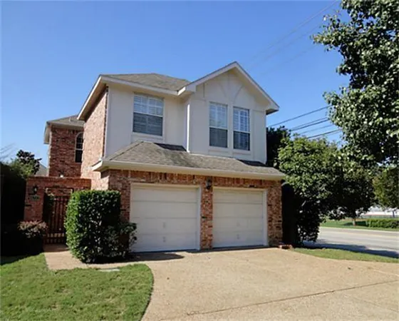 a front view of a house with a garage