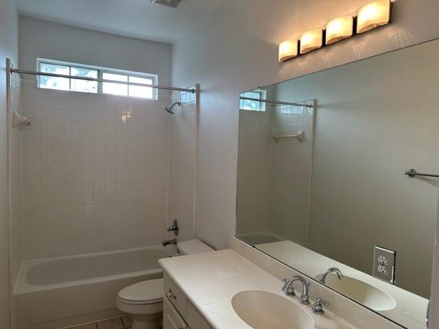 4202 Merrell Road Dallas, TX 75229 - Photo 15 of 16 a bathroom with a sink toilet and shower