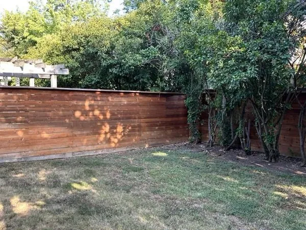 a backyard of a house with lots of green space