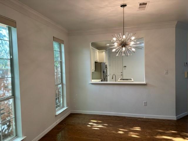 4202 Merrell Road Dallas, TX 75229 - Photo 5 of 16 a view of a room with window and wooden floor