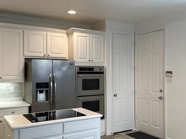 4202 Merrell Road Dallas, TX 75229 - Photo 7 of 16 a kitchen with a refrigerator sink and cabinets