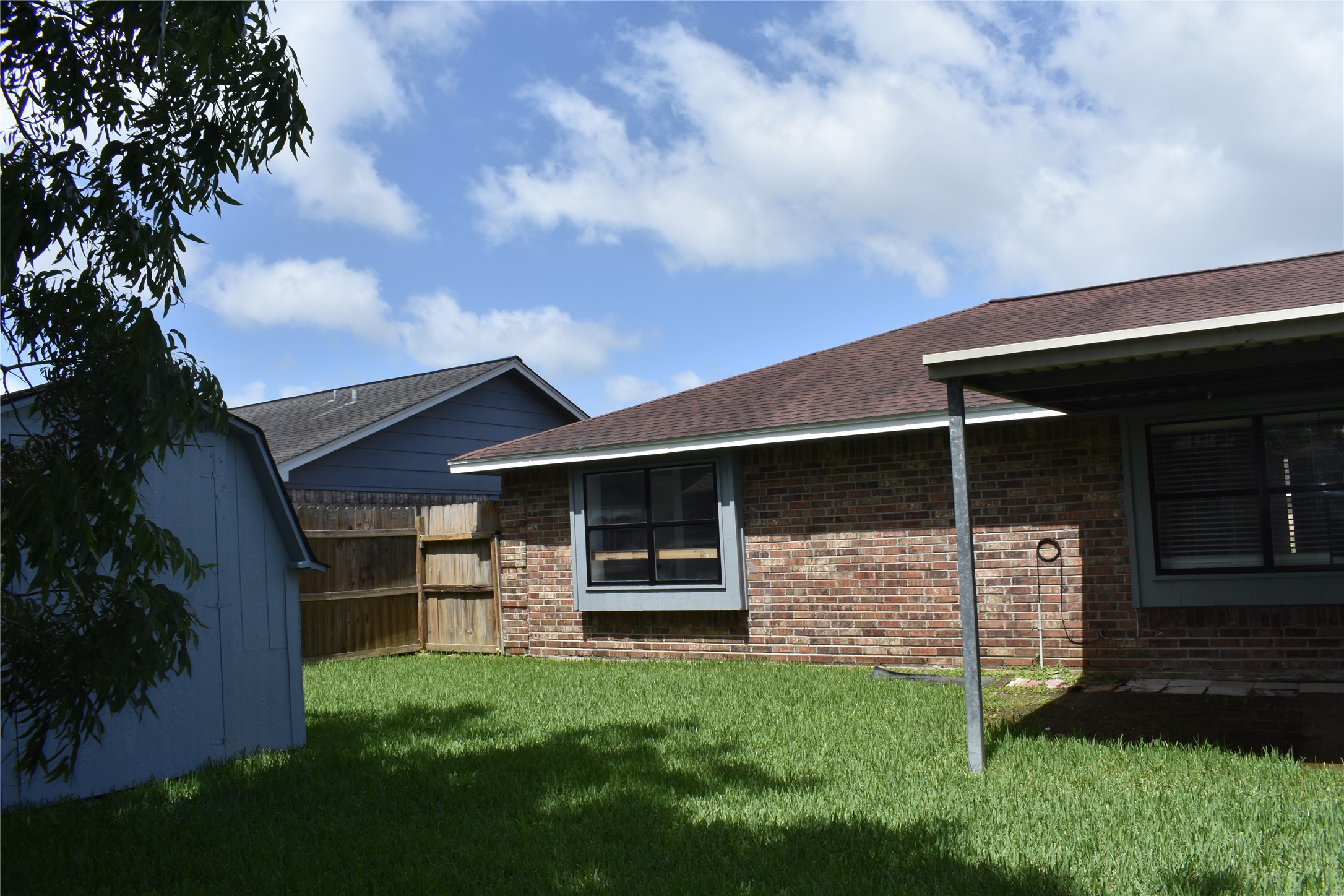 1347 Somercotes Lane Channelview, TX 77530 - Photo 29 of 30 a front view of a house with a garden
