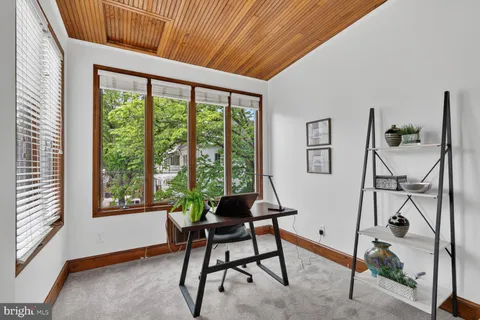 a workspace with furniture and a window