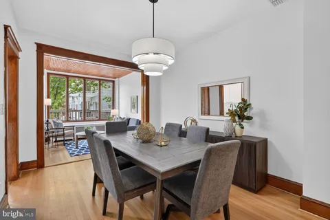 a view of a dining room with furniture window and wooden floor