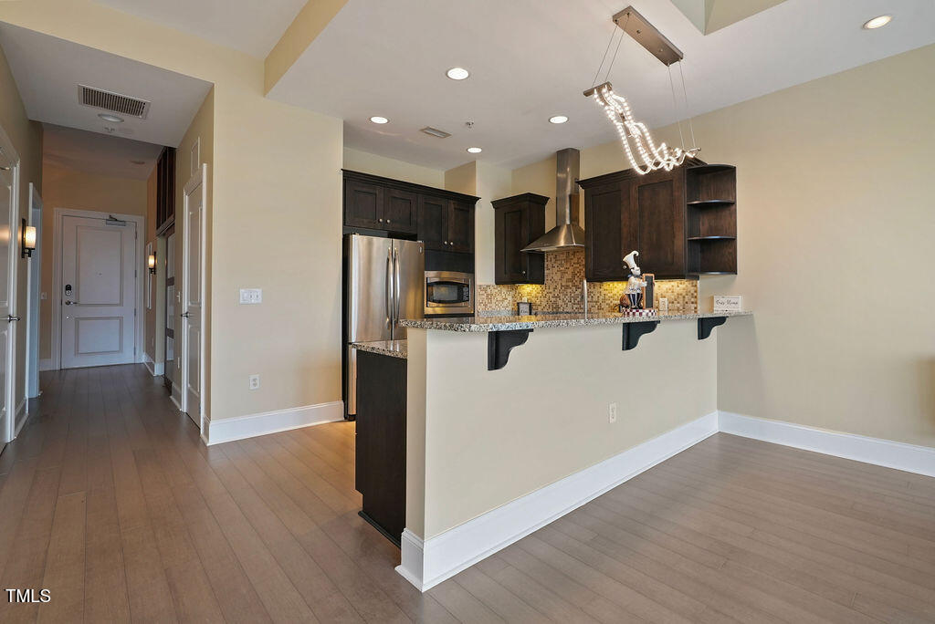400 West North Street, Unit 604 Raleigh, NC 27603 - Photo 19 of 46 a view of kitchen with refrigerator and window