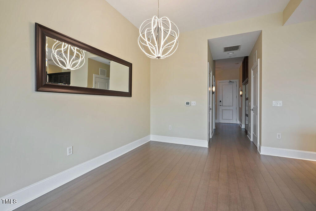 400 West North Street, Unit 604 Raleigh, NC 27603 - Photo 20 of 46 a view of empty room with wooden floor