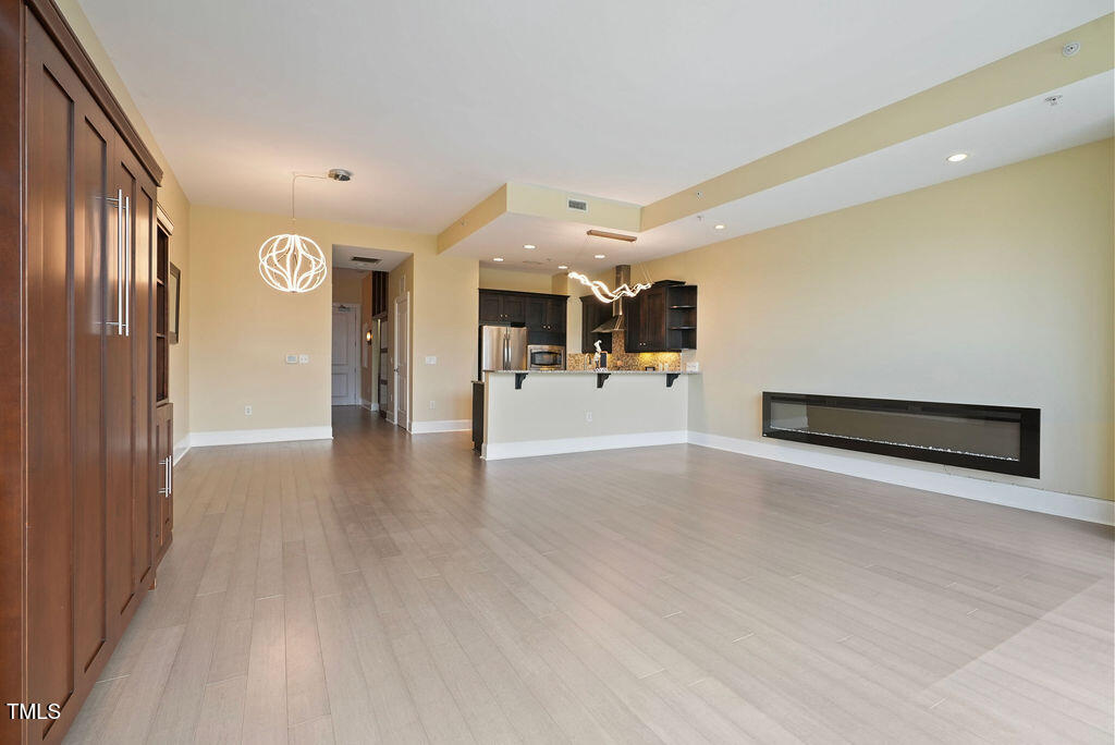400 West North Street, Unit 604 Raleigh, NC 27603 - Photo 24 of 46 a view of a hallway with entryway and livingroom