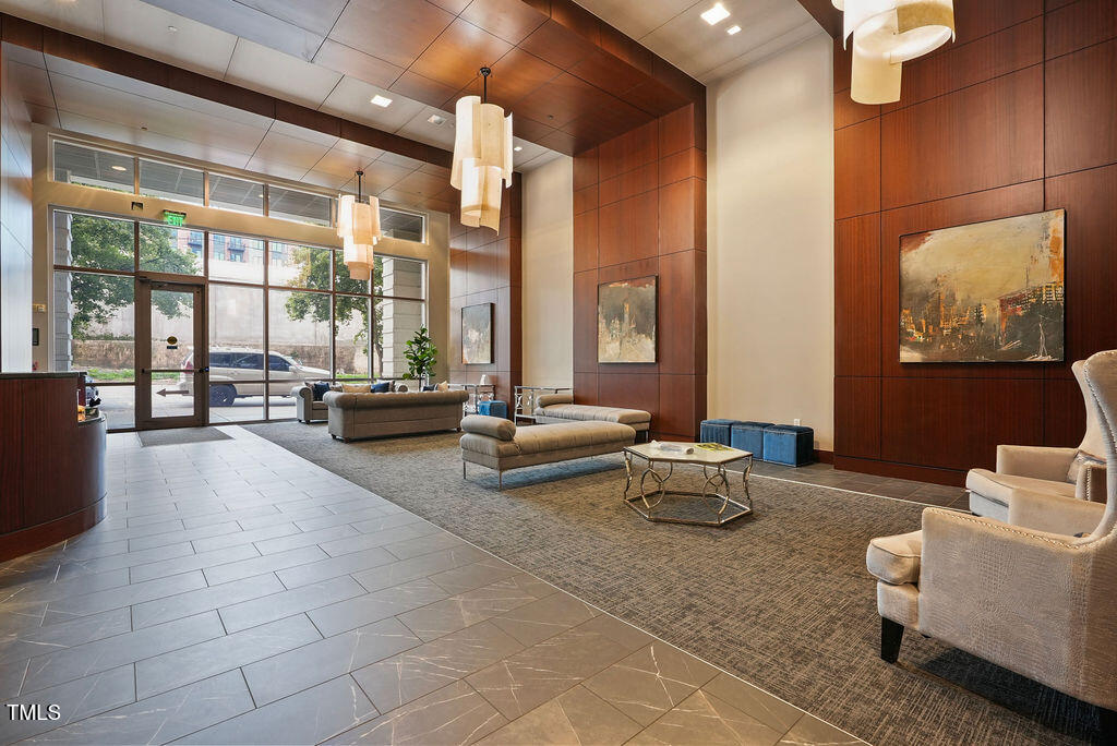 400 West North Street, Unit 604 Raleigh, NC 27603 - Photo 6 of 46 a living room with furniture and a large window