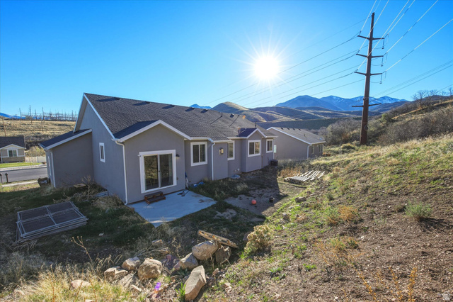 45 Memory Lane Tooele, UT 84074 - Photo 25 of 30 Back of house featuring a patio and a mountain view