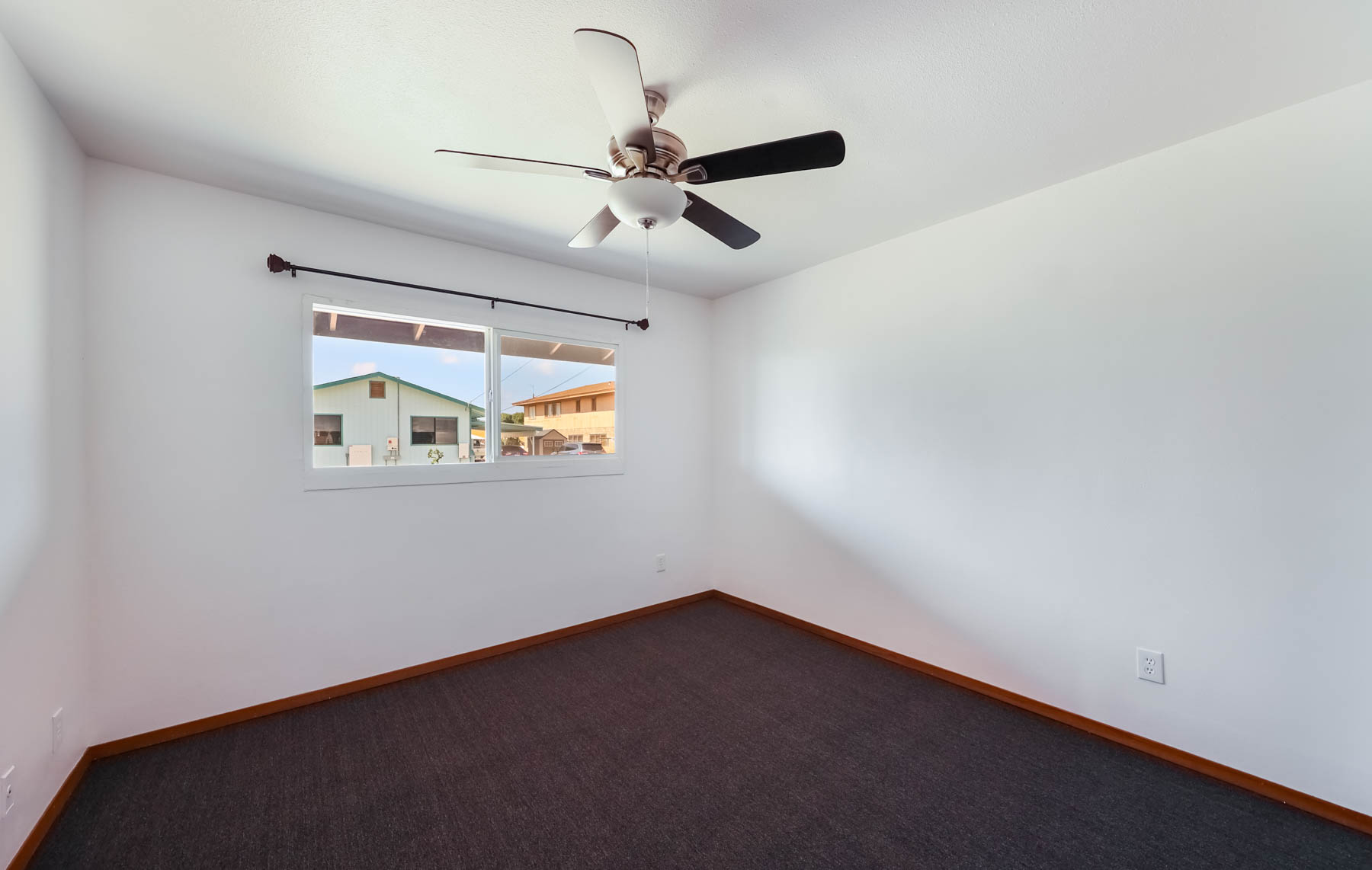 4604 Maile Road Waimea, HI 96796 - Photo 17 of 25 an empty room with a ceiling fan and a window