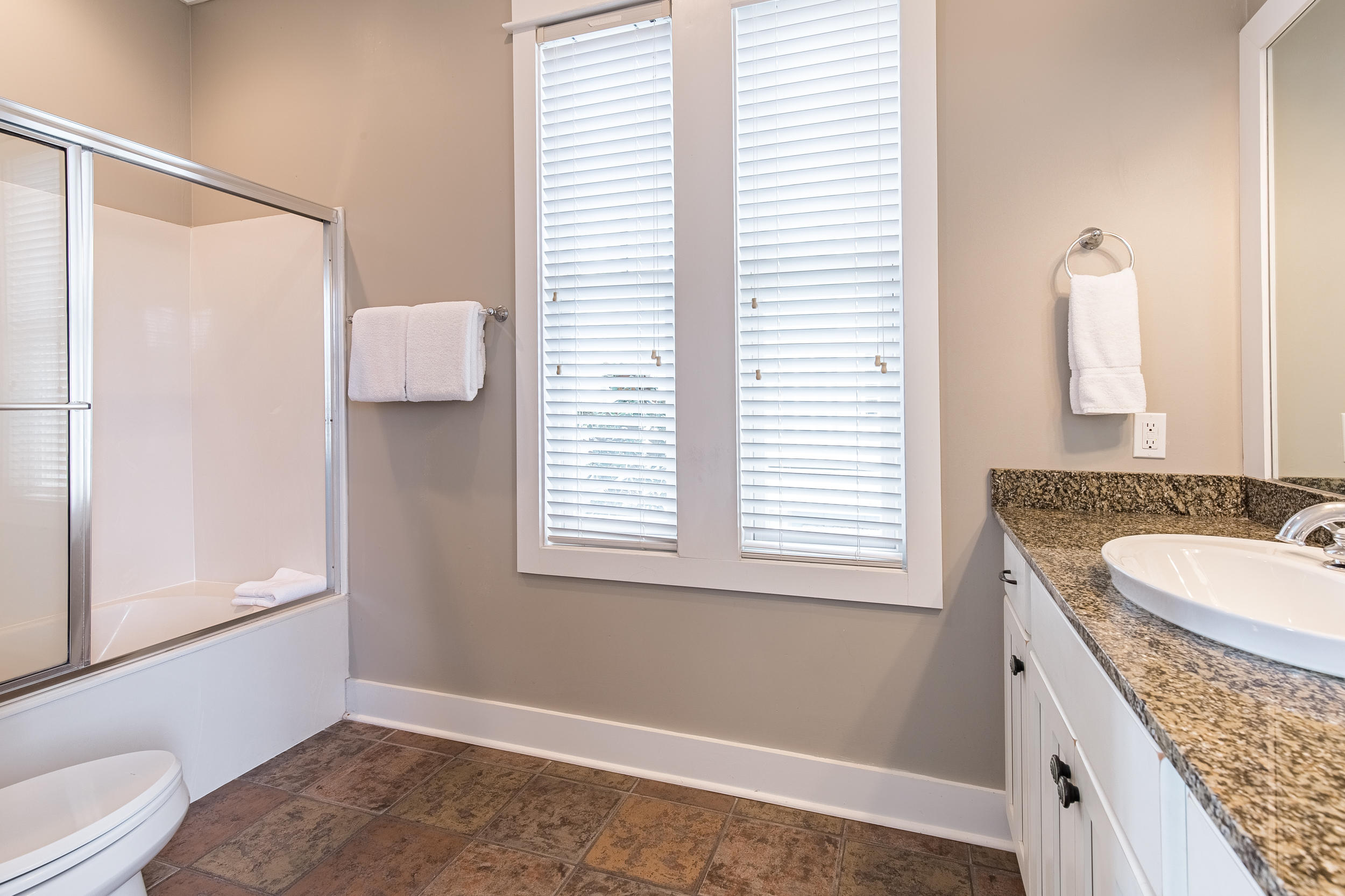 72 Chelsea Loop Road Santa Rosa Beach, FL 32459 - Photo 33 of 70 a bathroom with a granite countertop sink and a mirror