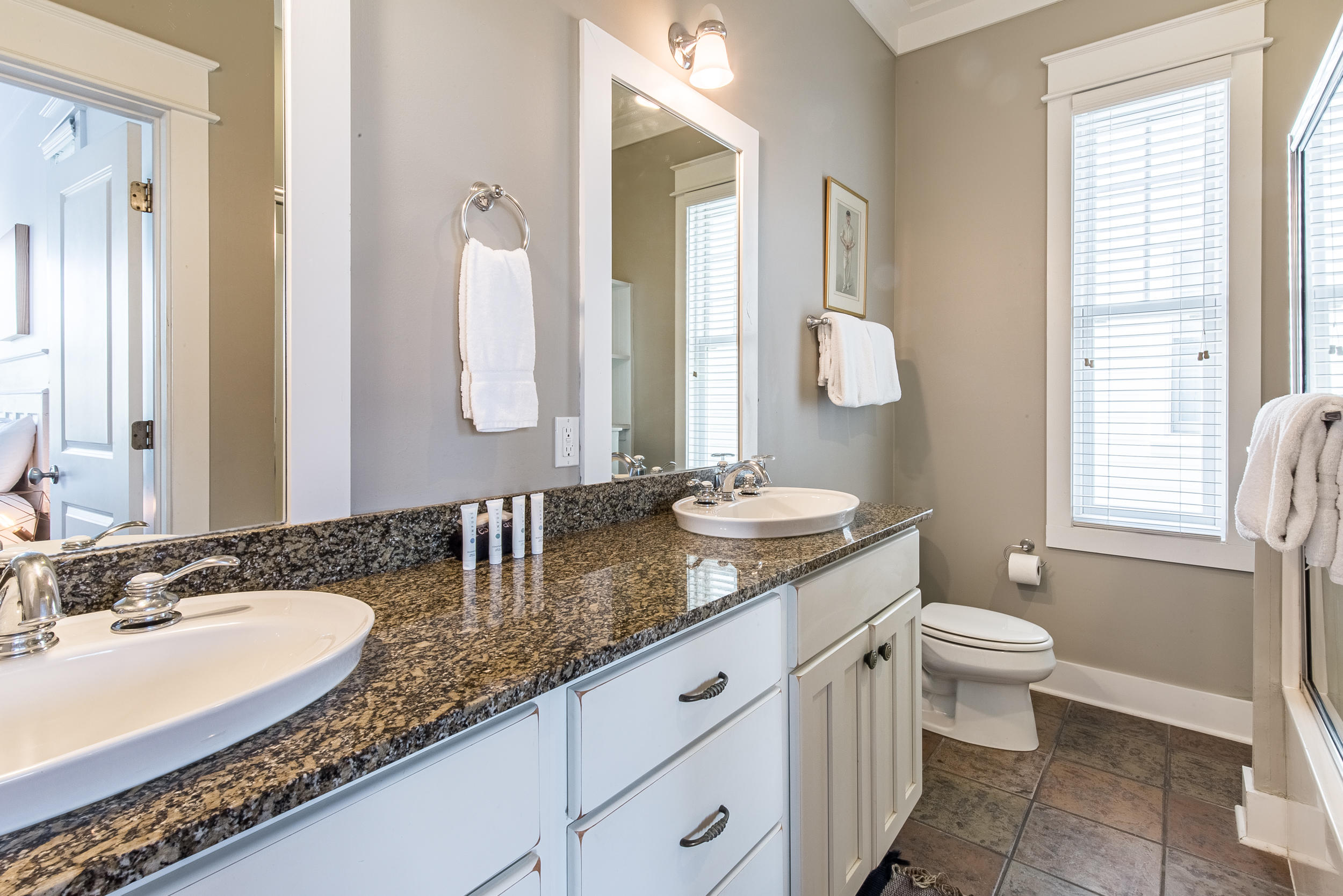 72 Chelsea Loop Road Santa Rosa Beach, FL 32459 - Photo 39 of 70 a bathroom with a granite countertop sink and a mirror