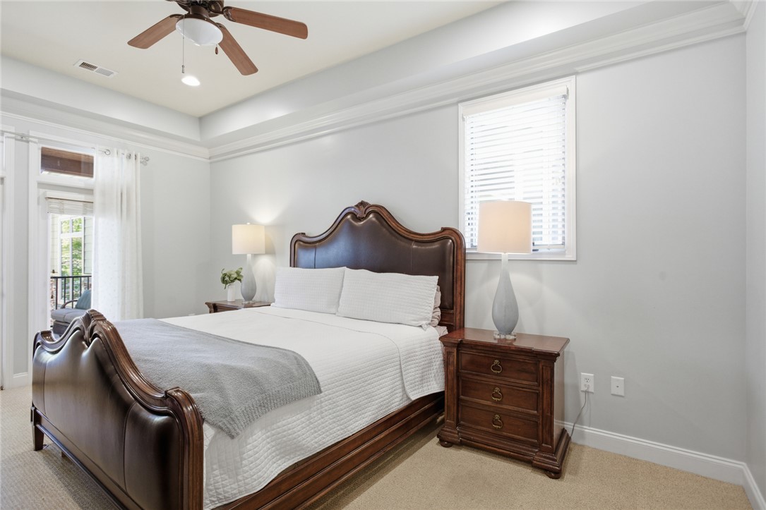 578 Sunset Point Drive West Union, SC 29696 - Photo 9 of 46 This serene bedroom offers a peaceful retreat with a private balcony and subtle design.