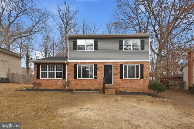 a view of backyard with a deck