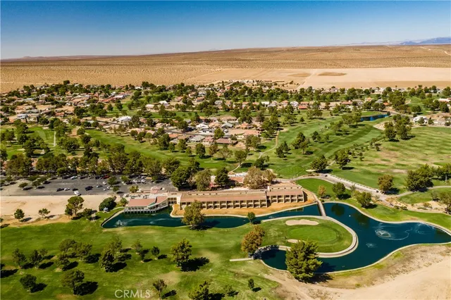 an aerial view of a house with a ocean view