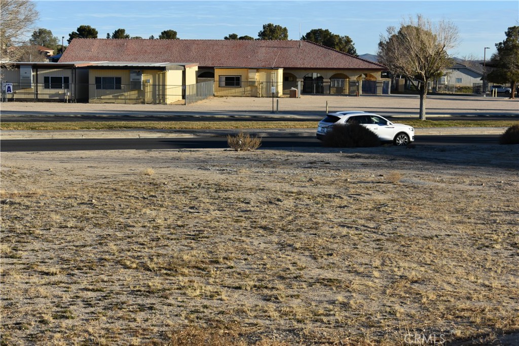 27231 Peach Tree Lane Helendale, CA 92342 - Photo 6 of 23 a front view of a house with a yard