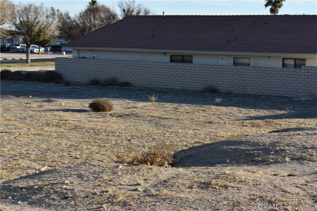 27231 Peach Tree Lane Helendale, CA 92342 - Photo 7 of 23 a view of a house with a yard
