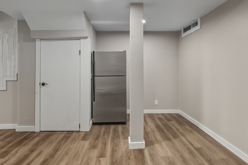 19 Delford Street Boston, MA 02131 - Photo 14 of 27 a view of empty room with wooden floor