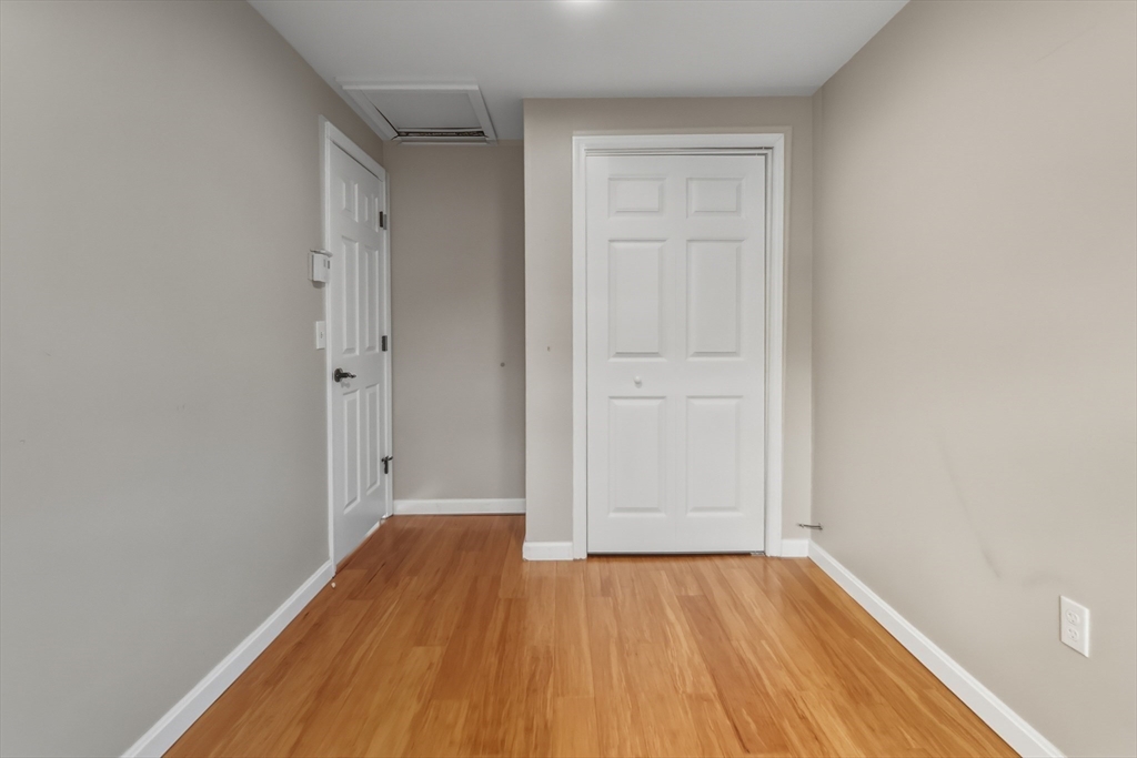 19 Delford Street Boston, MA 02131 - Photo 22 of 27 a view of an empty room with wooden floor