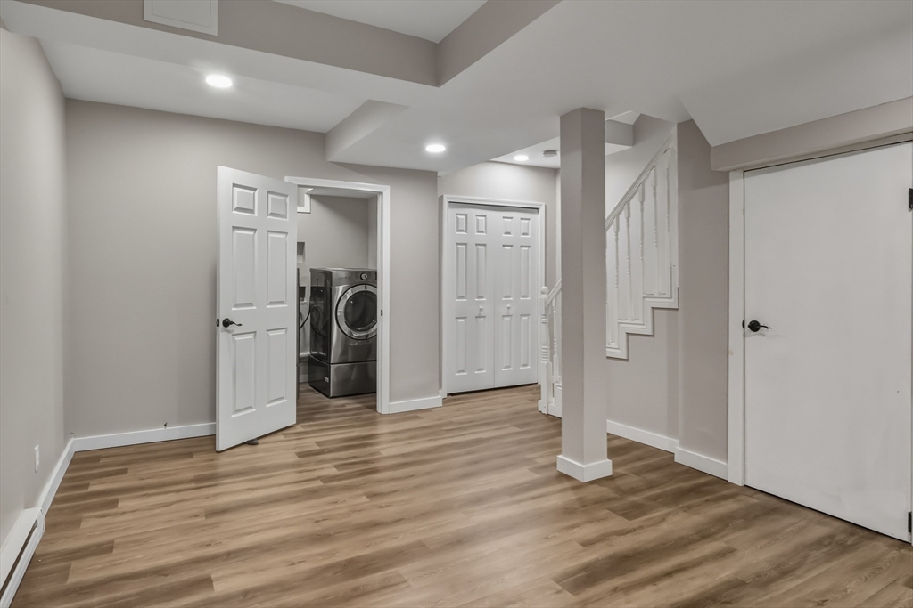 19 Delford Street Boston, MA 02131 - Photo 23 of 27 a view of a hallway with wooden floor