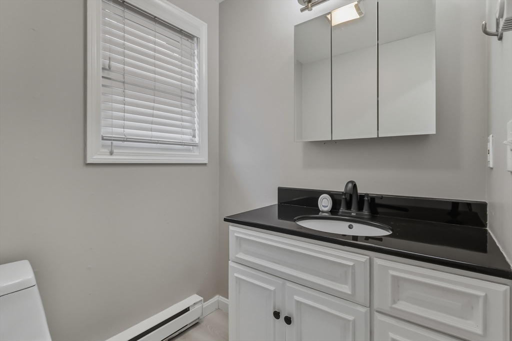 19 Delford Street Boston, MA 02131 - Photo 6 of 27 a kitchen with a sink and cabinets