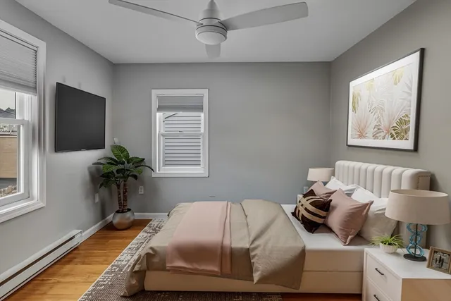 a bedroom with bed and a window