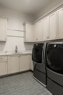 a utility room with cabinets