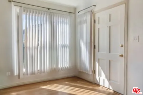 a view of entryway with wooden floor