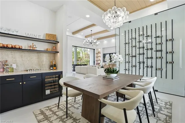 a kitchen with a dining table and chairs