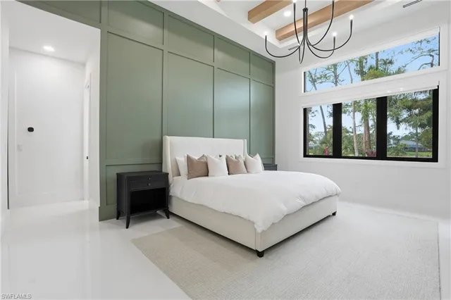 a spacious bathroom with a granite countertop sink and a mirror