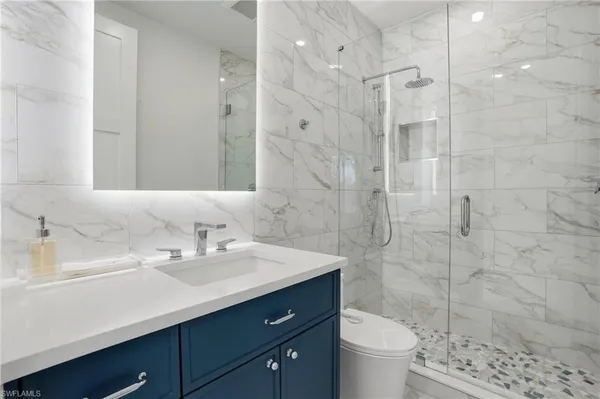 a bedroom with toys and a couch