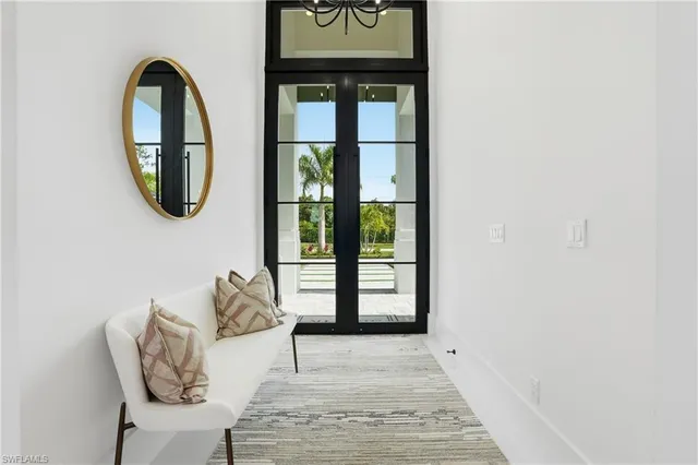 a view of entryway with furniture and wooden floor