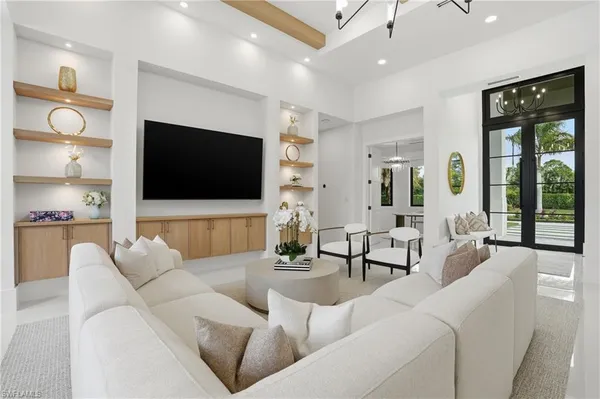 a living room with furniture and a flat screen tv