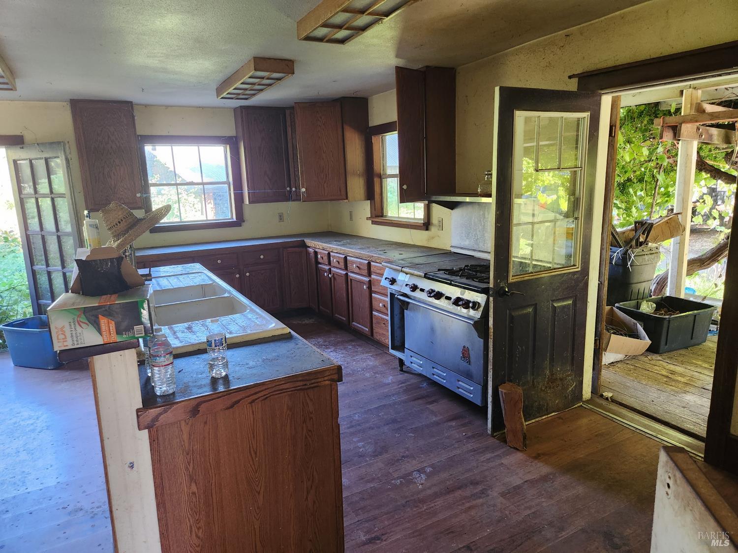 13333 Low Gap Road Ukiah, CA 95482 - Photo 7 of 50 a kitchen with wooden floors and a stove