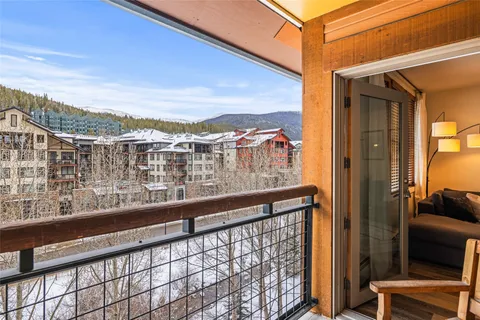 a view of a balcony with an outdoor seating
