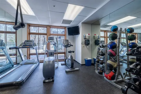 a view of a brick house with large windows