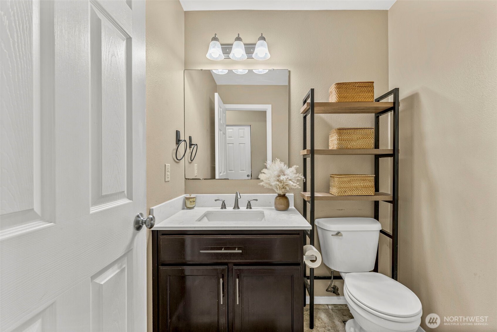 9115 Paradise View Street Yelm, WA 98597 - Photo 20 of 40 a bathroom with a sink vanity mirror and toilet