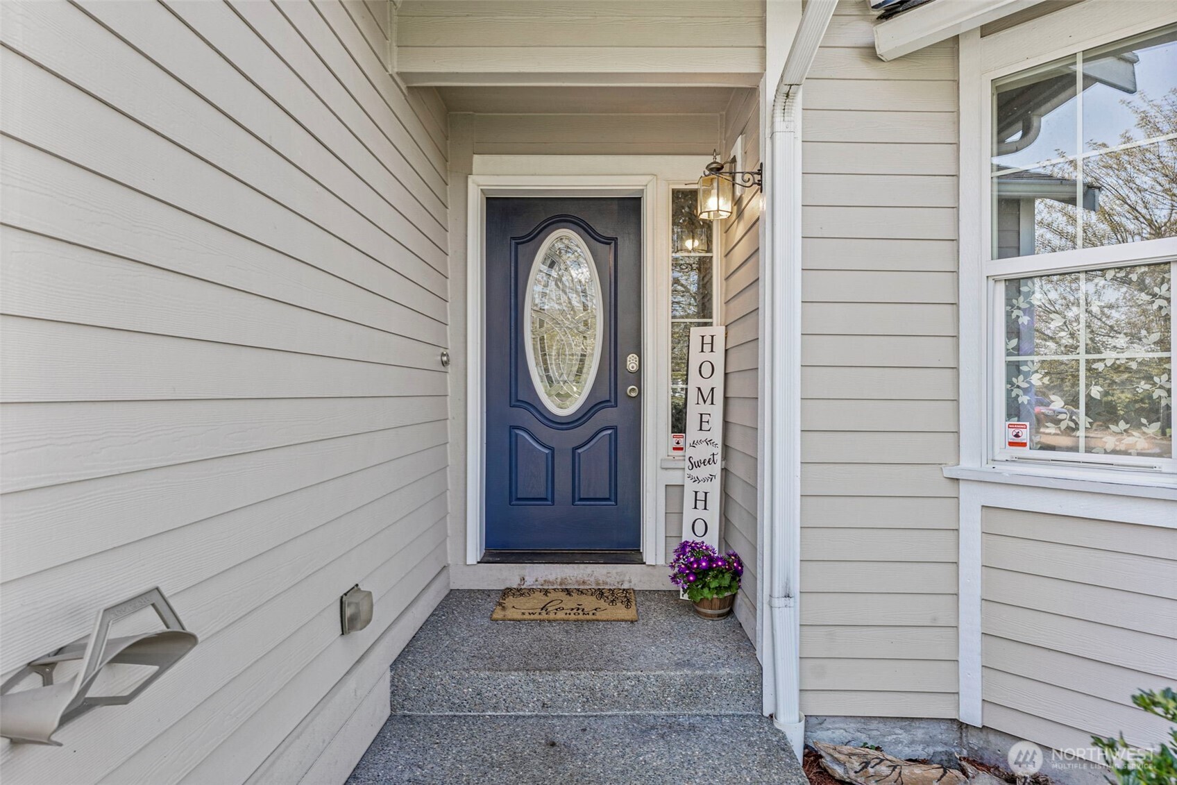 9115 Paradise View Street Yelm, WA 98597 - Photo 2 of 40 a front view of a house with a garden