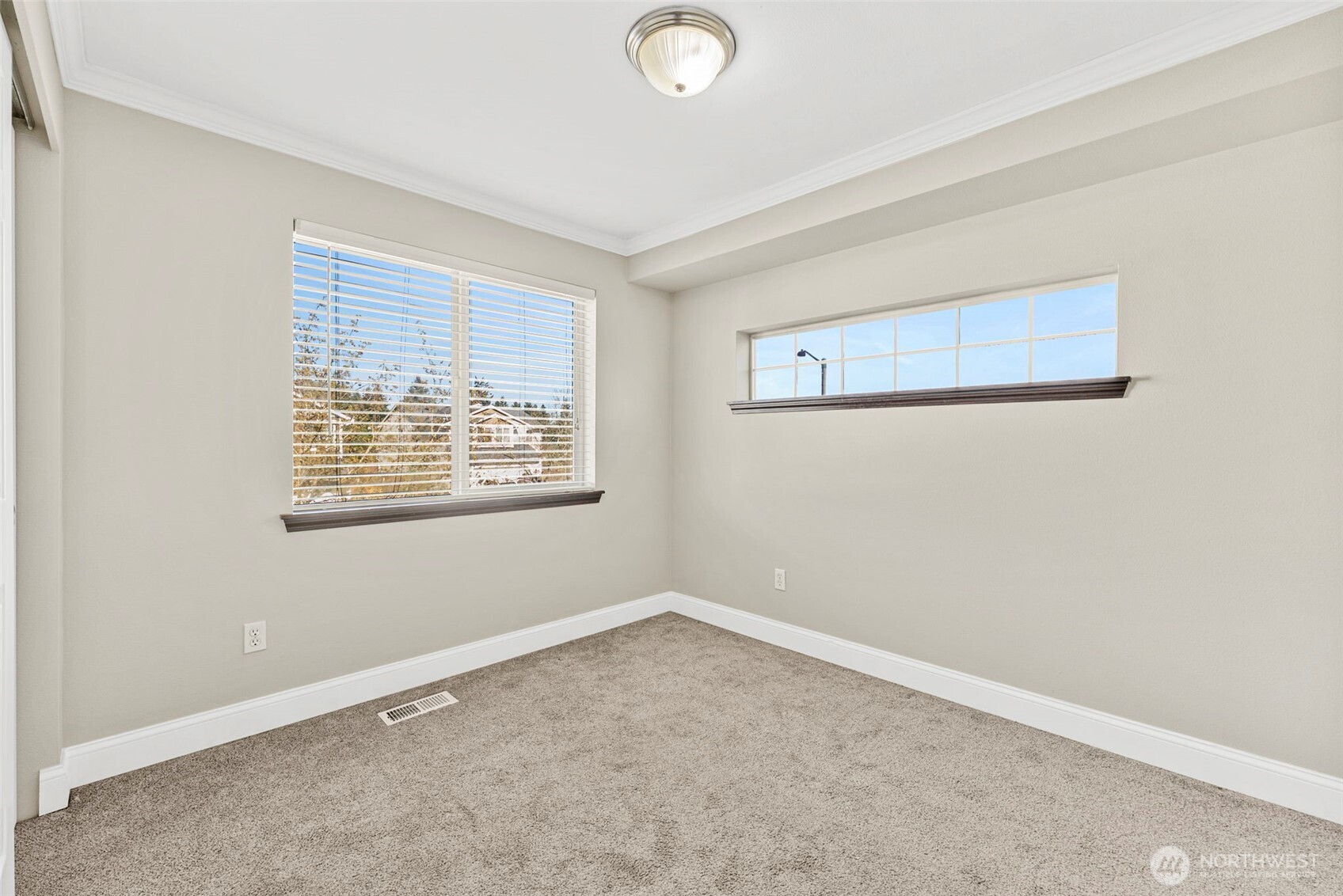 9115 Paradise View Street Yelm, WA 98597 - Photo 21 of 40 an empty room with windows