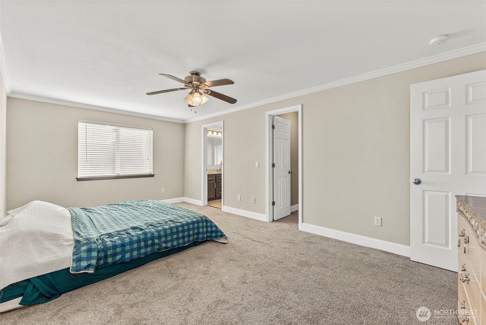 9115 Paradise View Street Yelm, WA 98597 - Photo 24 of 40 a bedroom with a bed and a chandelier