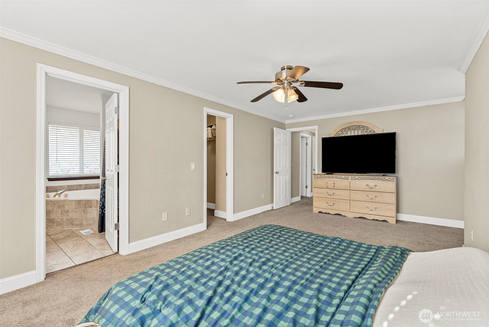 9115 Paradise View Street Yelm, WA 98597 - Photo 26 of 40 a living room with a flat screen tv and a rug